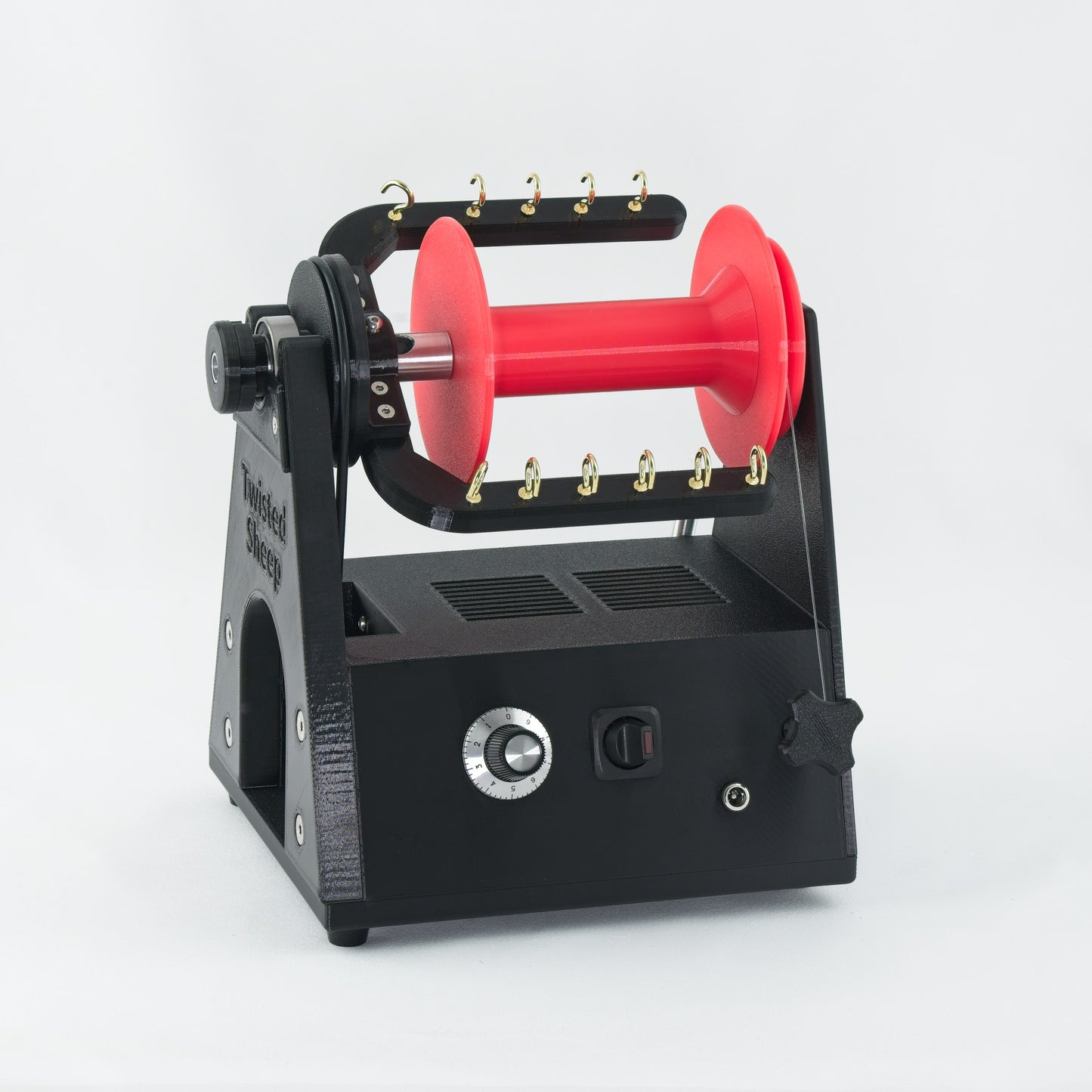 Twisted Sheep portable electric spinning wheel with red bobbin