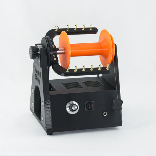 Twisted Sheep portable electric spinning wheel with orange bobbin