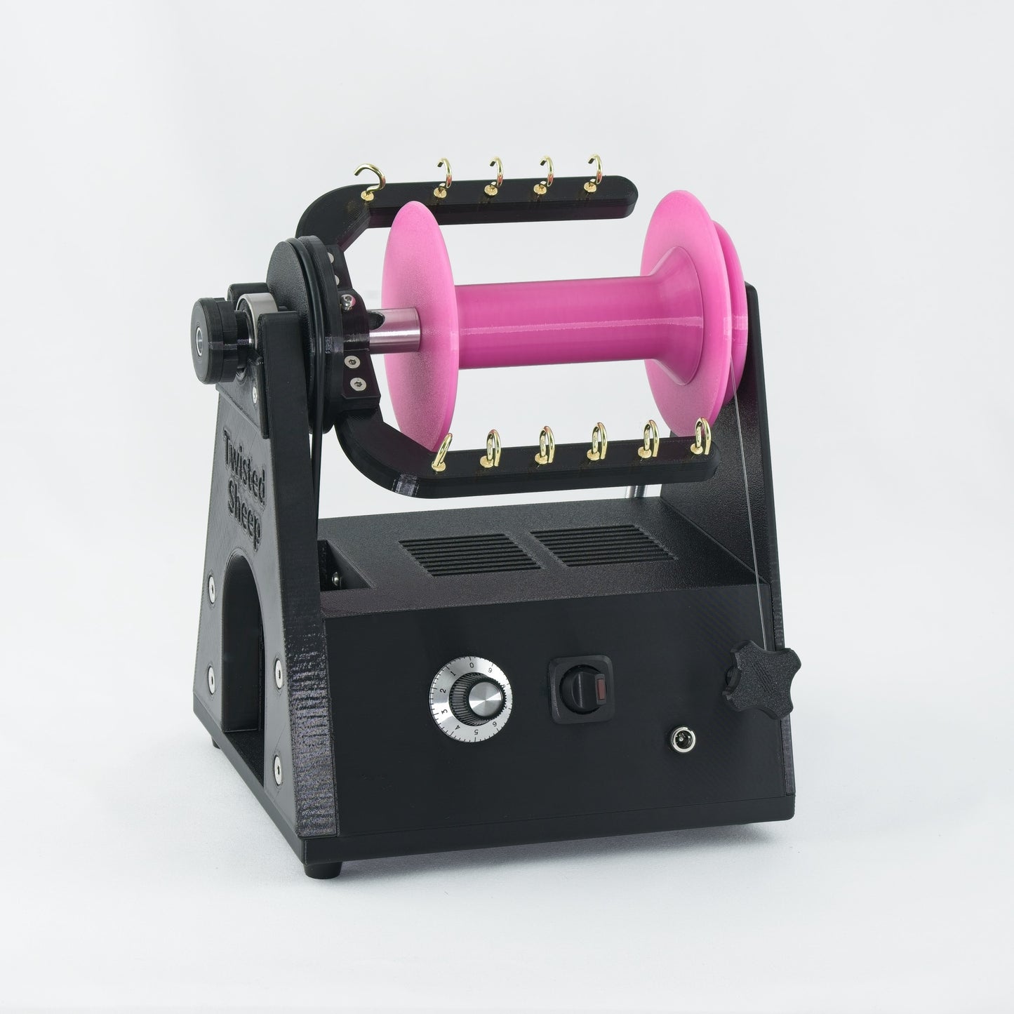 Twisted Sheep portable electric spinning wheel with pink bobbin