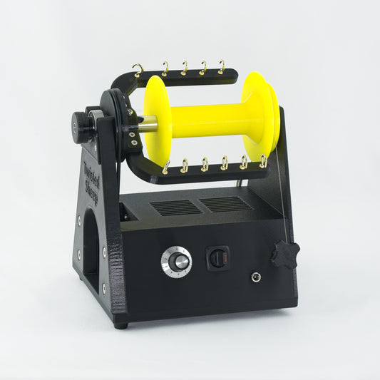 Twisted Sheep portable electric spinning wheel with yellow bobbin