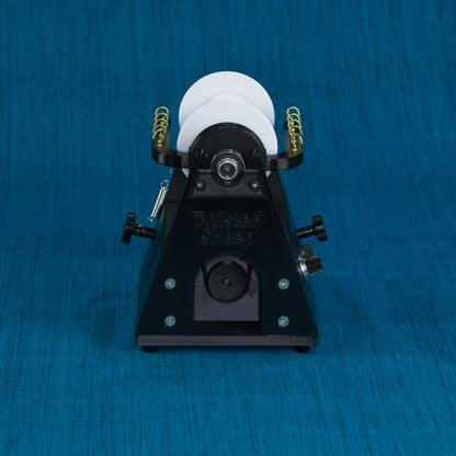 Twisted Sheep portable electric spinning wheel front view showing flyer orifice and drive band