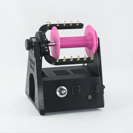 Twisted Sheep portable electric spinning wheel with pink bobbin